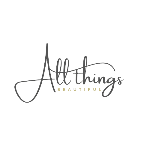 Logo for All Things Beautiful lifestyle blog featuring elegant script font for 'All things' in charcoal gray and 'BEAUTIFUL' in uppercase gold serif letters